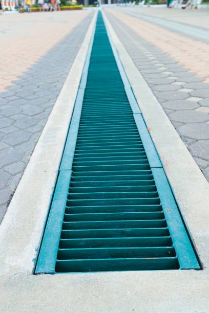 caniveau évacuation des eaux de pluie espace public collectivité